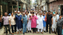 সন্ত্রাস ও চাঁদাবাজদের বিরুদ্ধে ব্যবসায়ীদের লাঠি মিছিল